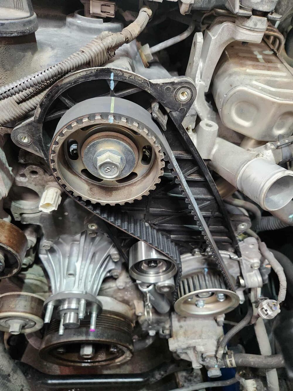 New timing belt fitted to an engine.